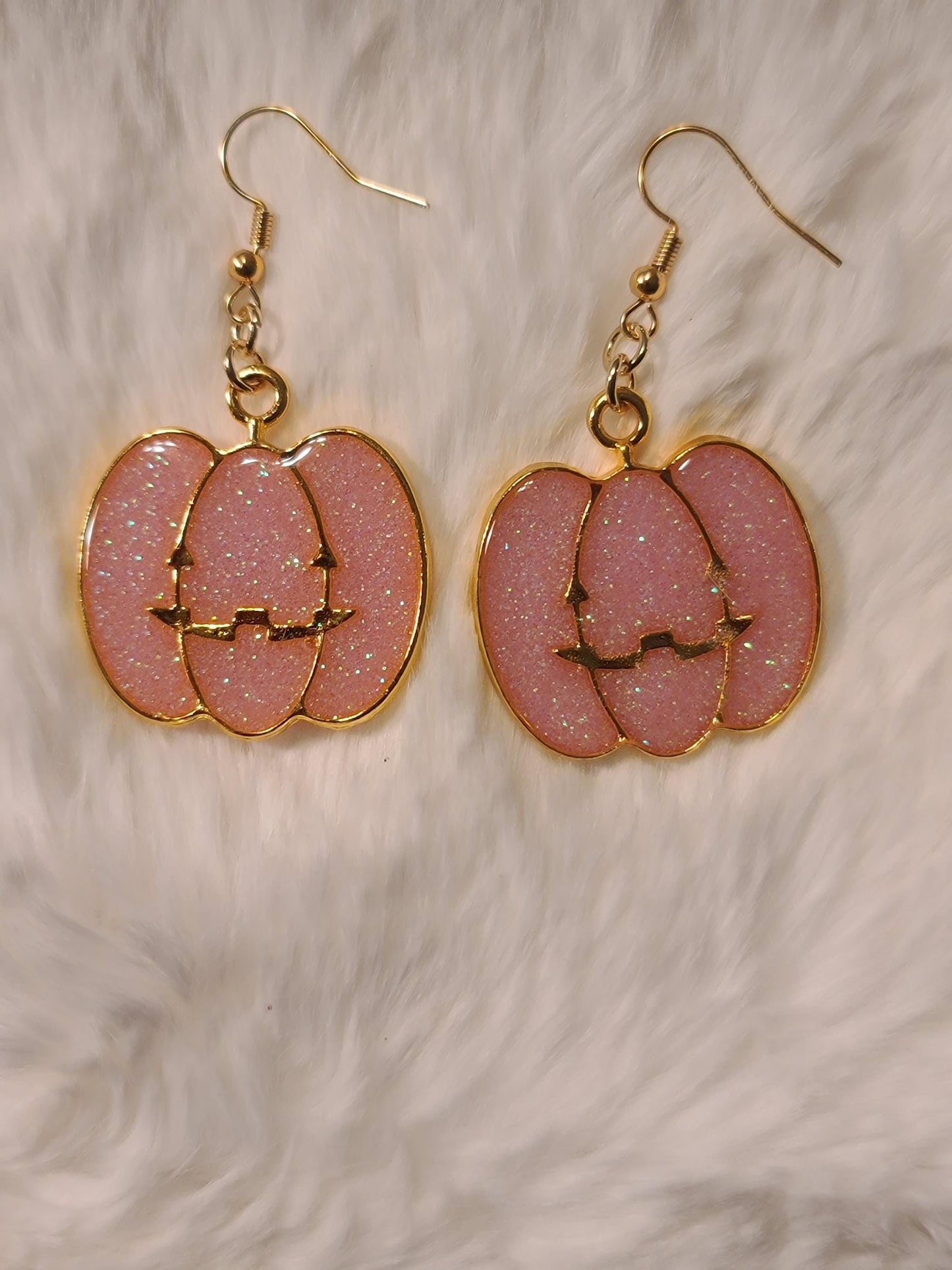 Pink pumpkin face earrings